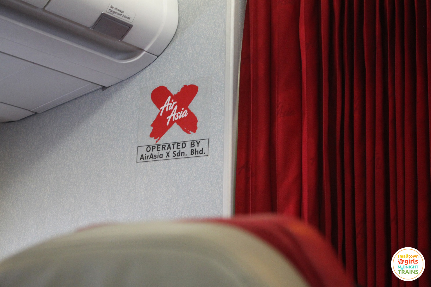 When you're cooped up in an airplane for hours on end, you do silly things like take photos of logos.